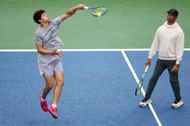 Ben Shelton (left) practices at the 2025 US Open under the tutelage of father and coach Bryan (right) (Source: Getty)
